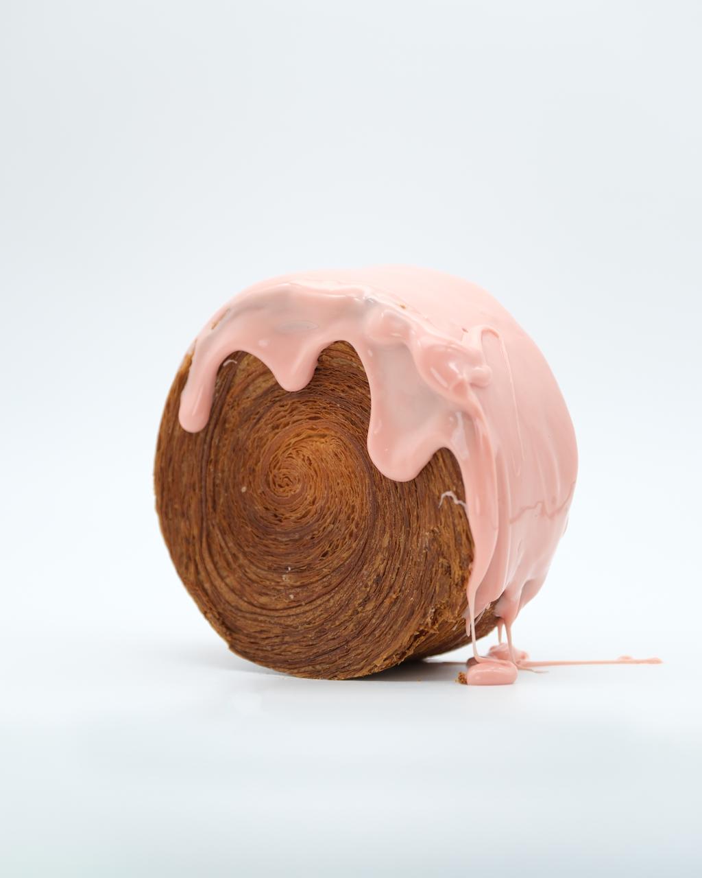 Roll croissant with pink chocolate